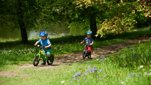 Young boys on bikes at Stourhead, Wiltshire